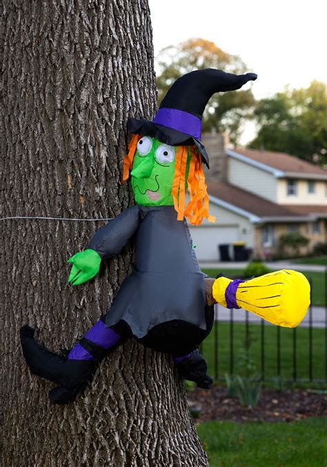 Bring the Enchantment of Halloween with a Witch Crashing into a Tree Decoration
